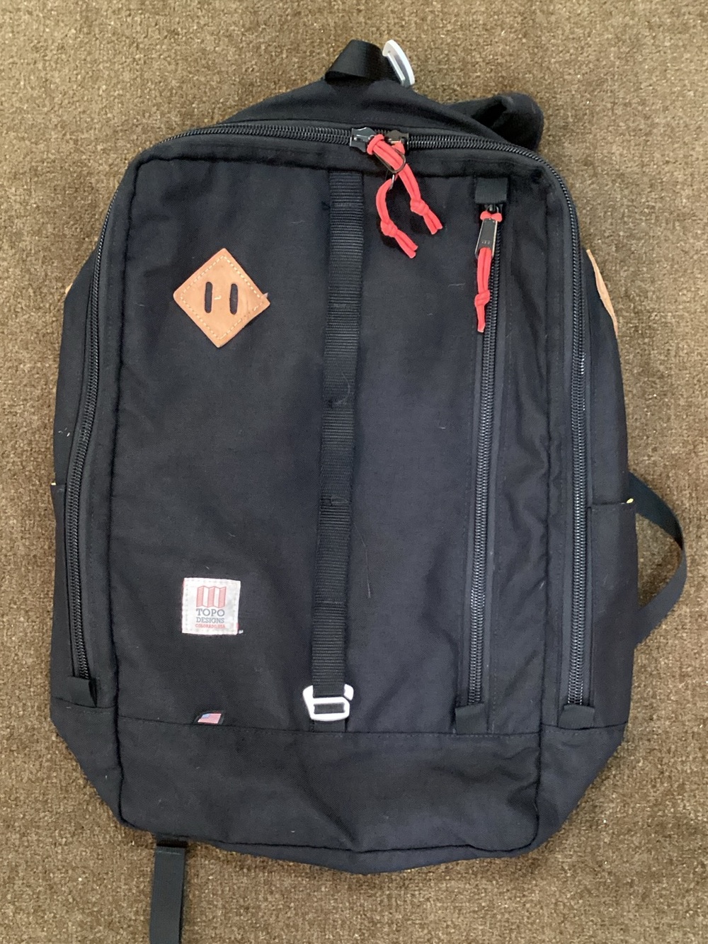 Topo Designs Black Canvas Backpack with Red Pulls